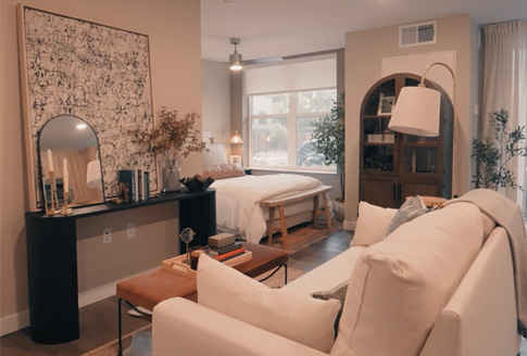 Weathervane model unit showcasing couch, artwork and coffeetable